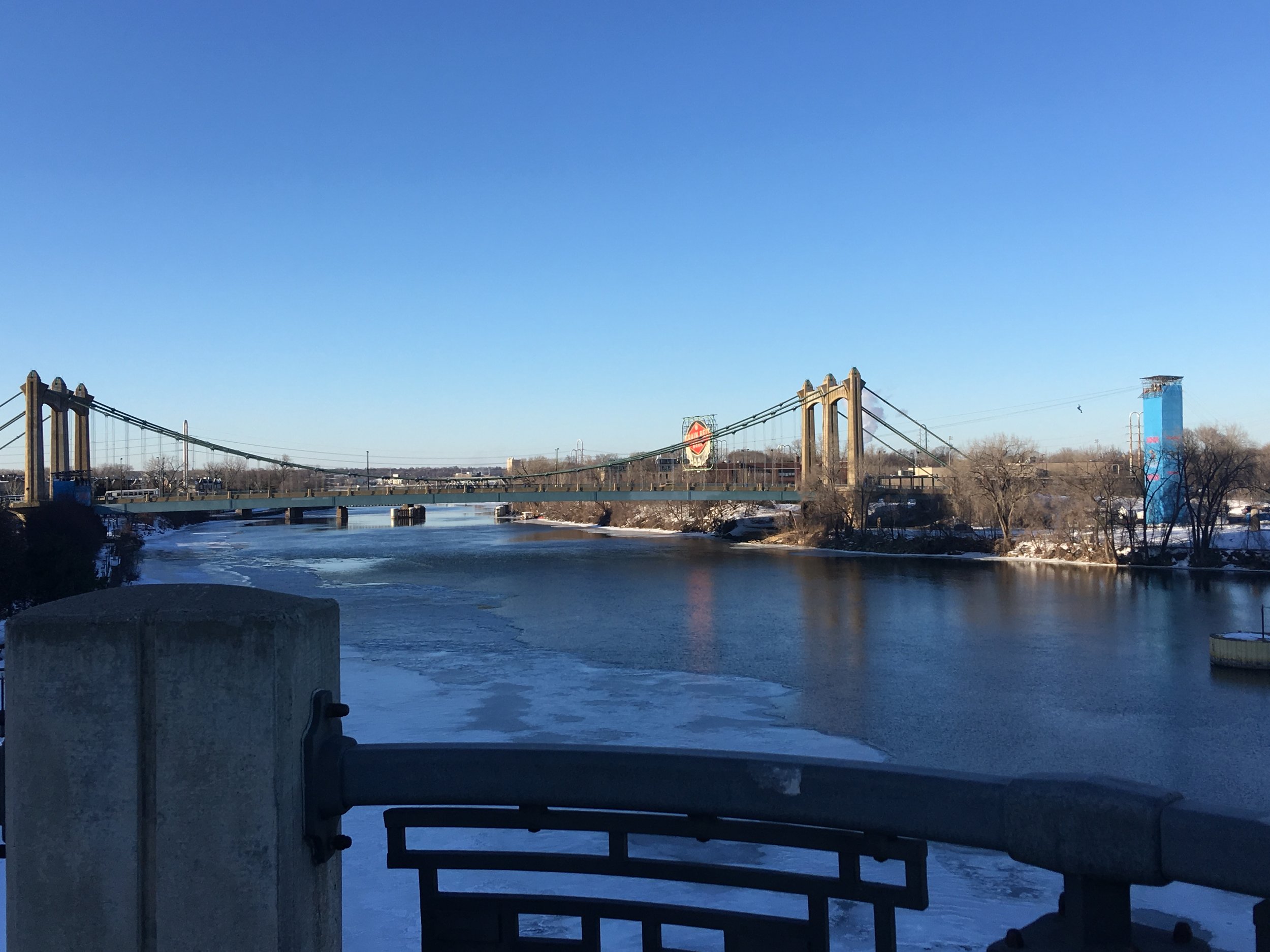 If you look really close you can see a person beginning their zip line journey across the Mississippi River, leaving the blue tower on the right