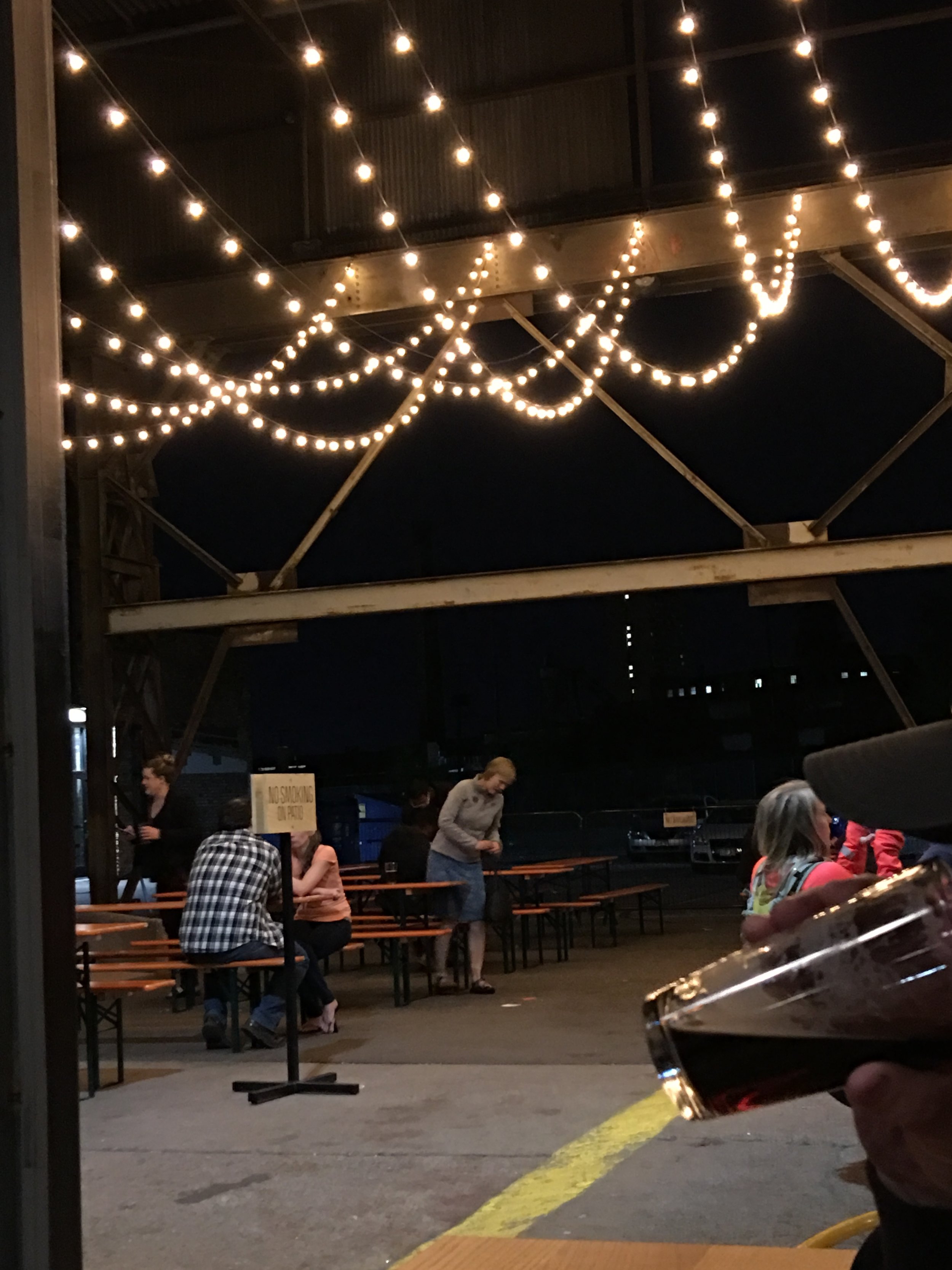 Outdoor patio space at Bauhaus Brew Labs welcoming adults, kids, and dogs in the summer time