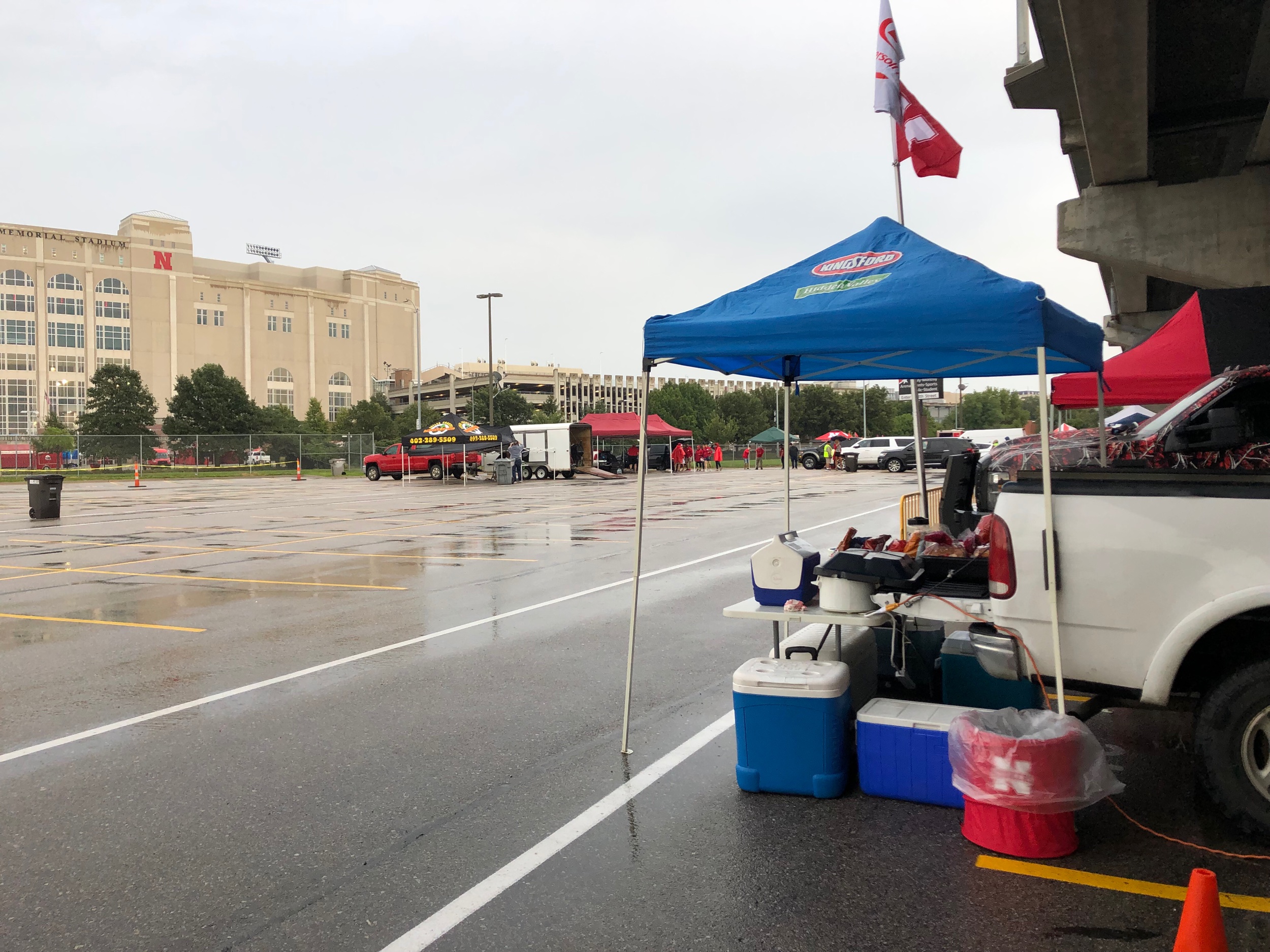The committee few braving the rain to tailgate