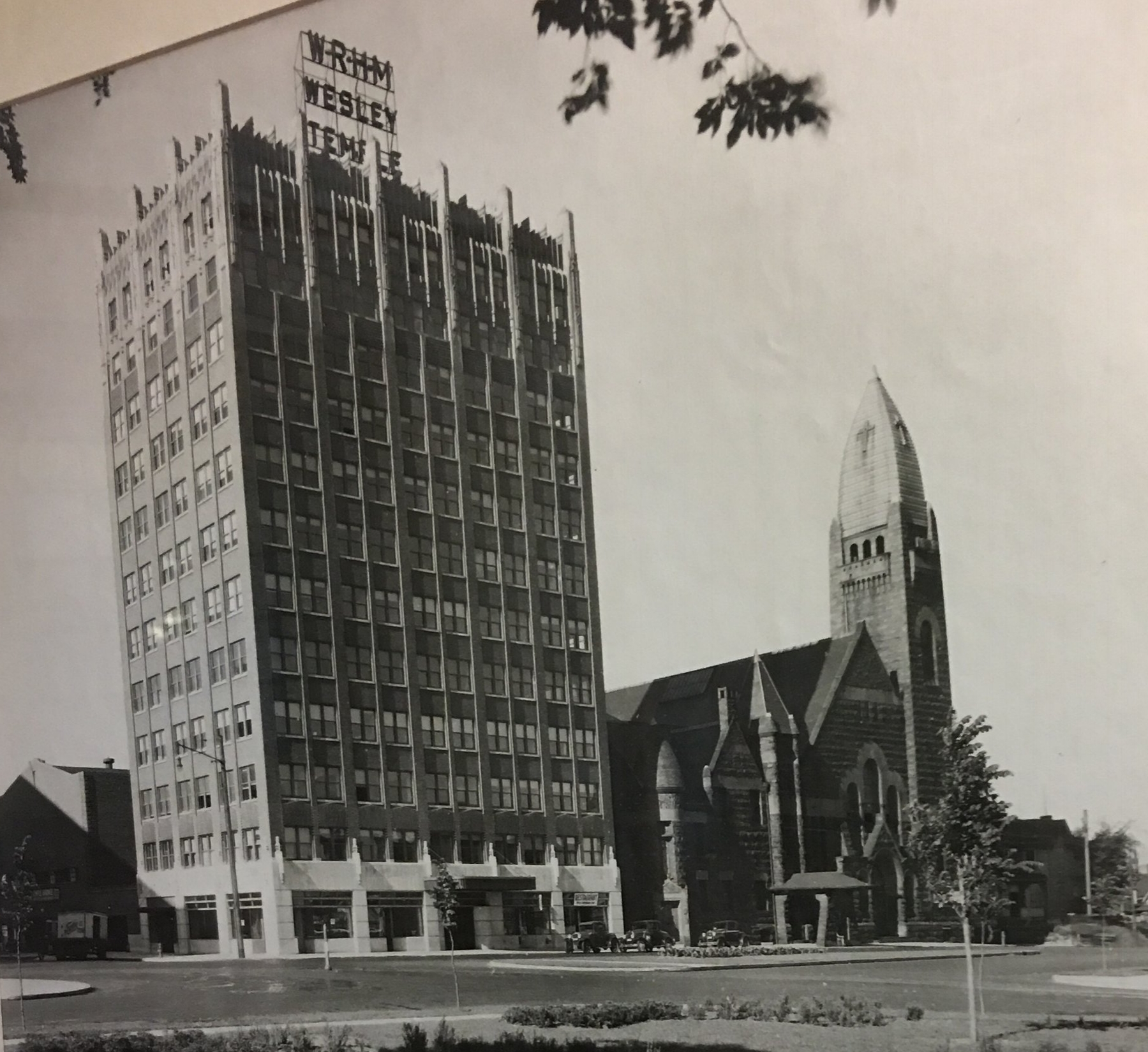 Historic photograph of the Temple Building with the church in the background that hangs in one of the rooms of the Center