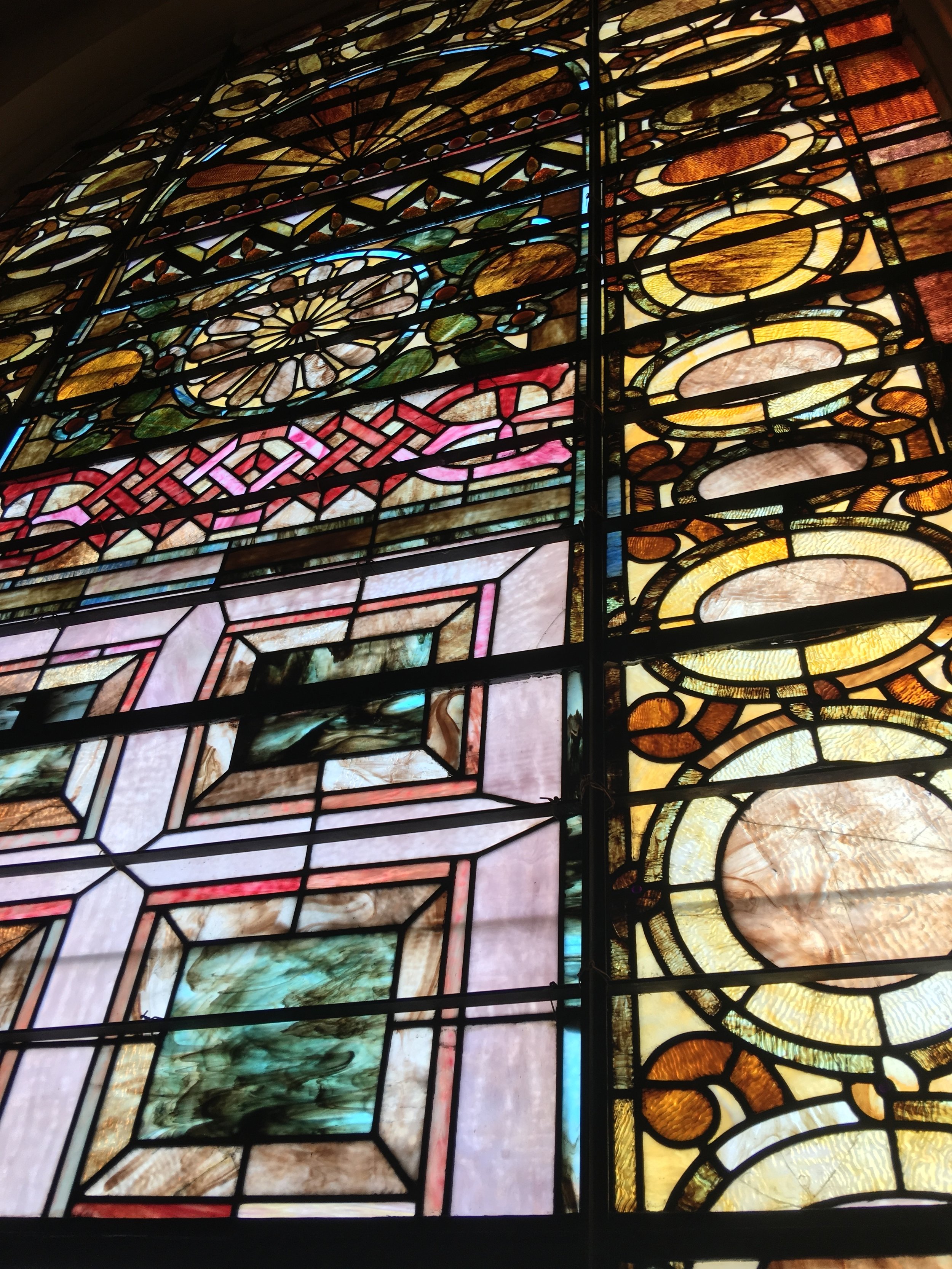 Just one of the many original stained glass windows