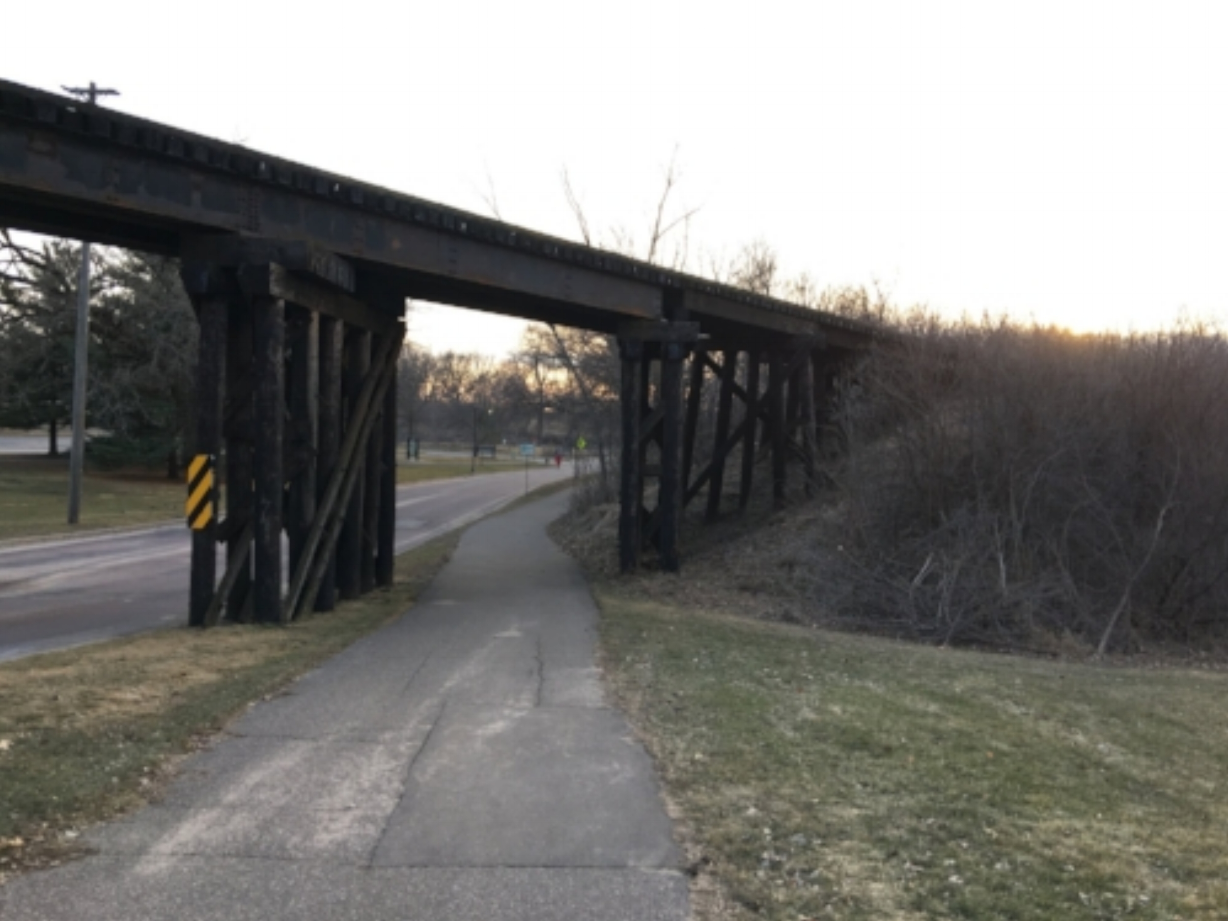Entering under the first train bridge into the park